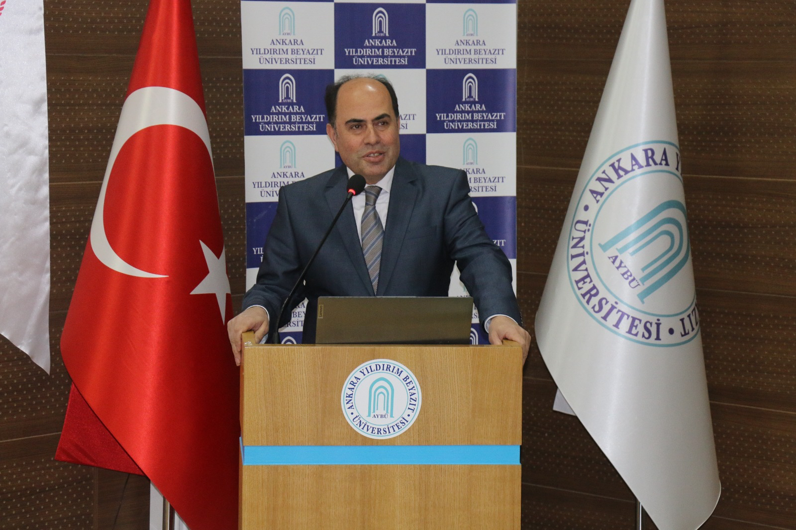 A photograph of our Vice Rector Prof. Dr. Mustafa Orçan speaking at the podium.