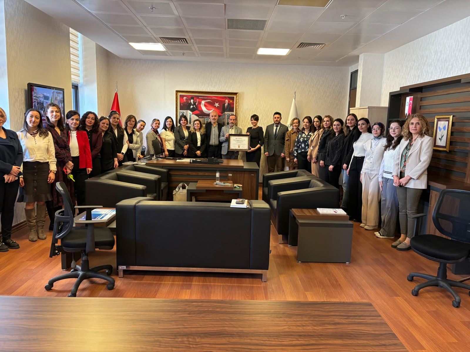 A group photograph featuring the Dean, the Deputy Dean, the Head of the Nursing Department and members of the academic staff
