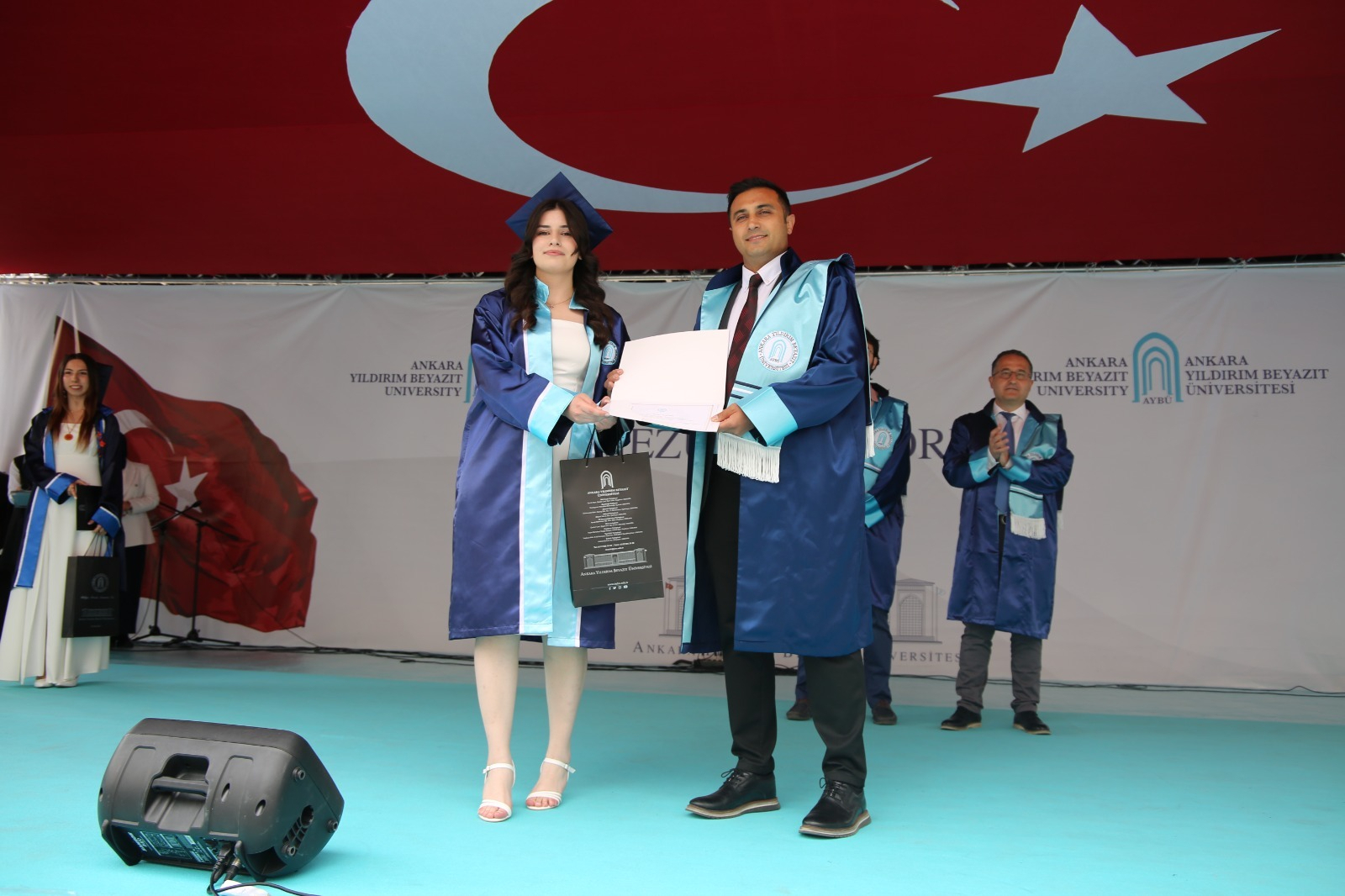 Prof. Dr. Selahattin Çelik, Head of the Department of Mechanical Engineering, presenting the department valedictorian certificate to Özge Sağır during the 2024–2025 Academic Year Graduation Ceremony.